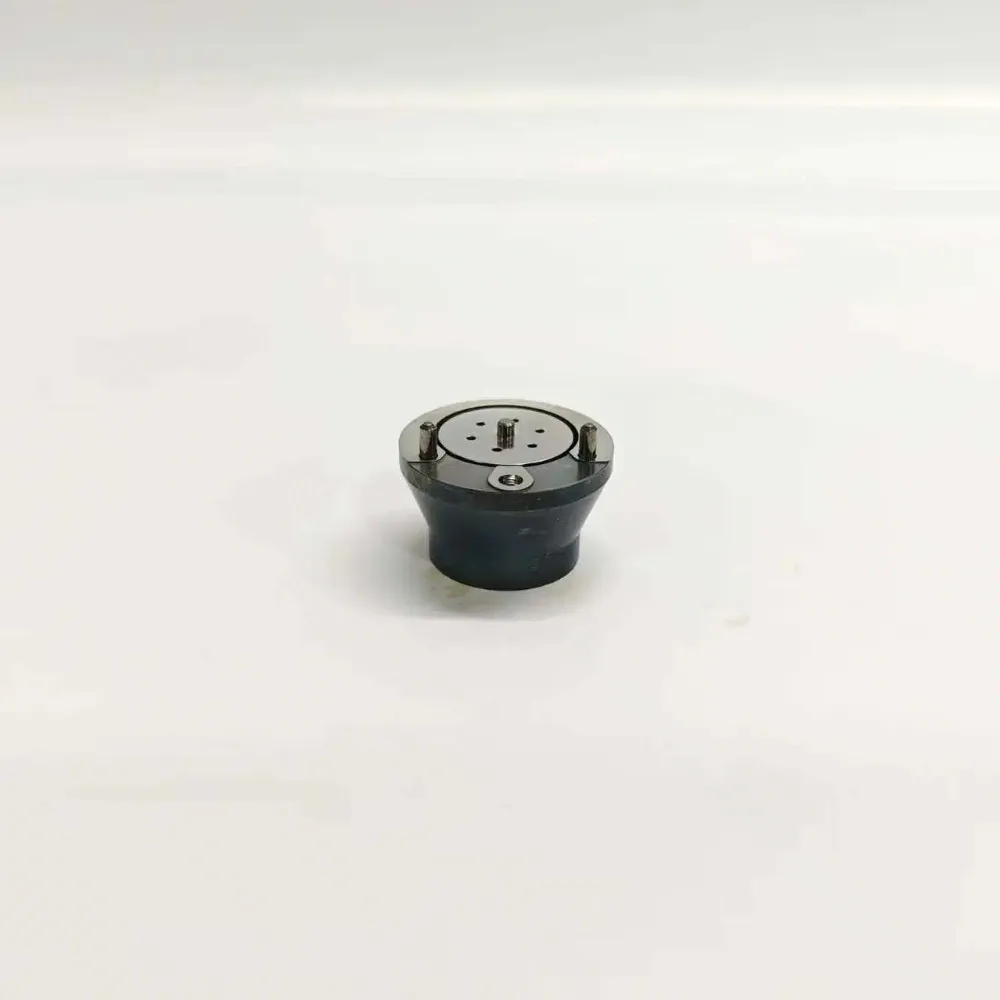2-7206-1010-1K061010-64-F2P-BEBJ1D04001-EUI-Control-Valve-Main-Image Direct top-down view of 7206-1010 1K061010-64 electronic unit injector control valve assembly featuring a circular polished face plate with integrated small fluid ports and dual alignment dowels.