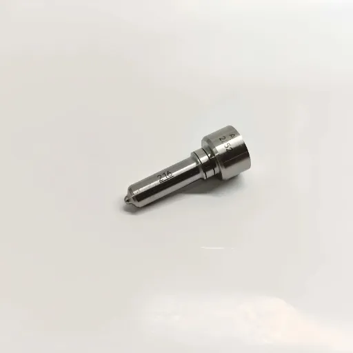 Angled view of the L216PBC diesel injector nozzle showing the smooth machined metallic body surface and specialized atomization spray tip.