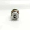 4-RE517661-Injector-Control-Valve-1K135486-64-Bottom-Face Bottom end view of the 1K135486-64 EUI control valve showing the circular fuel passage holes and the precision-ground central valve orifice interface.