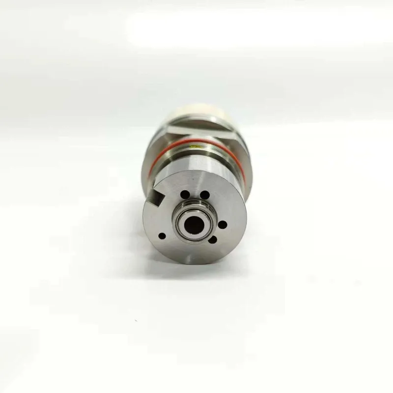 4-RE517661-Injector-Control-Valve-1K135486-64-Bottom-Face Bottom end view of the 1K135486-64 EUI control valve showing the circular fuel passage holes and the precision-ground central valve orifice interface.