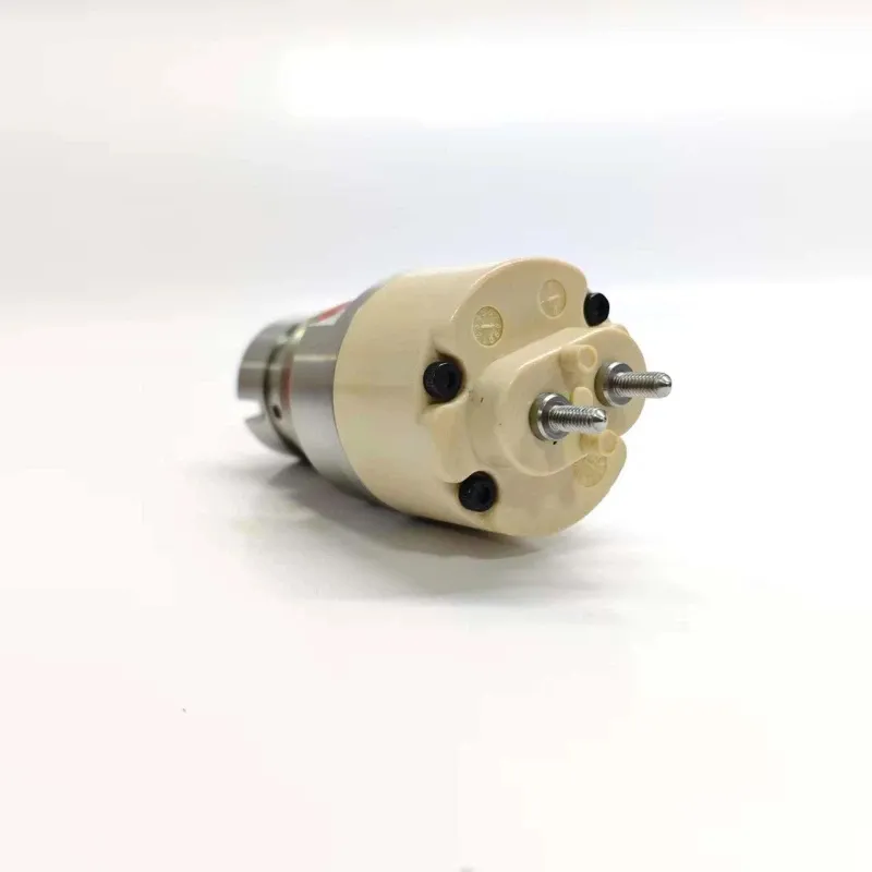 6-1K135486-64-Electronic-Unit-Injector-Valve-Rear-Solenoid Alternate view of the upper actuator solenoid body for the 1K135486-64 valve showing the fastening screws and molded casing markers.