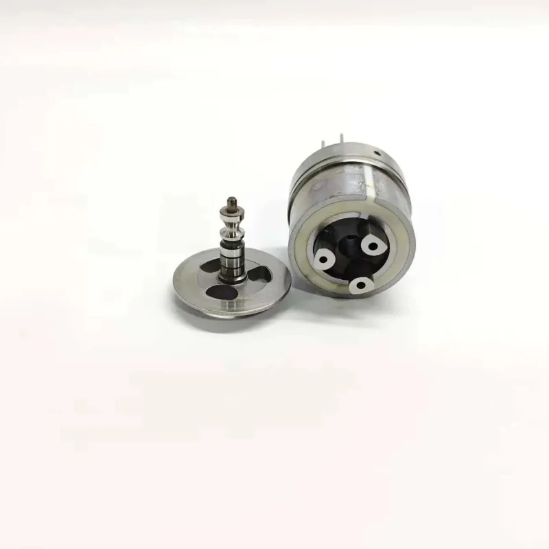 John-Deere-3840043-Unit-Injector-Valve-1K060372-64-Bottom-Profile Inverted bottom angle view of replacement injector control valve 1K060372-64 suitable for John Deere heavy-duty fuel systems, displaying internal base channels alongside its corresponding armature plate component.