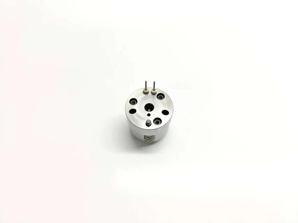 Top-down profile view of aftermarket E1 series unit injector control valve 7206-0379 suitable for Volvo, displaying the laser-etched matrix data tracking code on the polished outer casing surface.