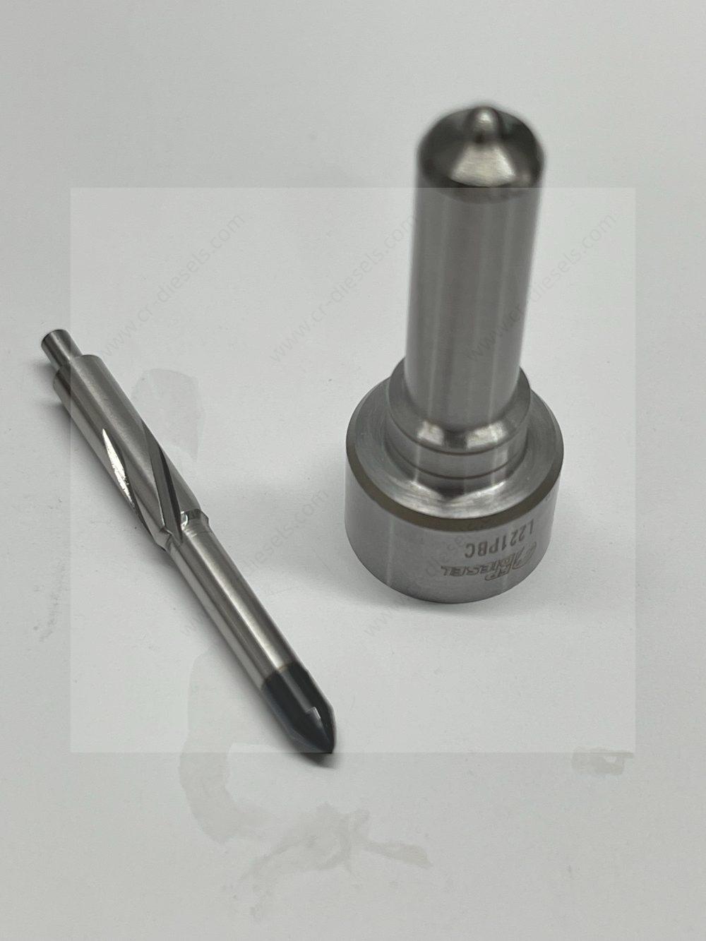 dlw-nozzle-nz7001-l221pbc-needle-disassembly-angled Angled disassembled view of DLW NZ7001 nozzle and matching needle, highlighting the micro-ground sliding surfaces for high-pressure sealing.