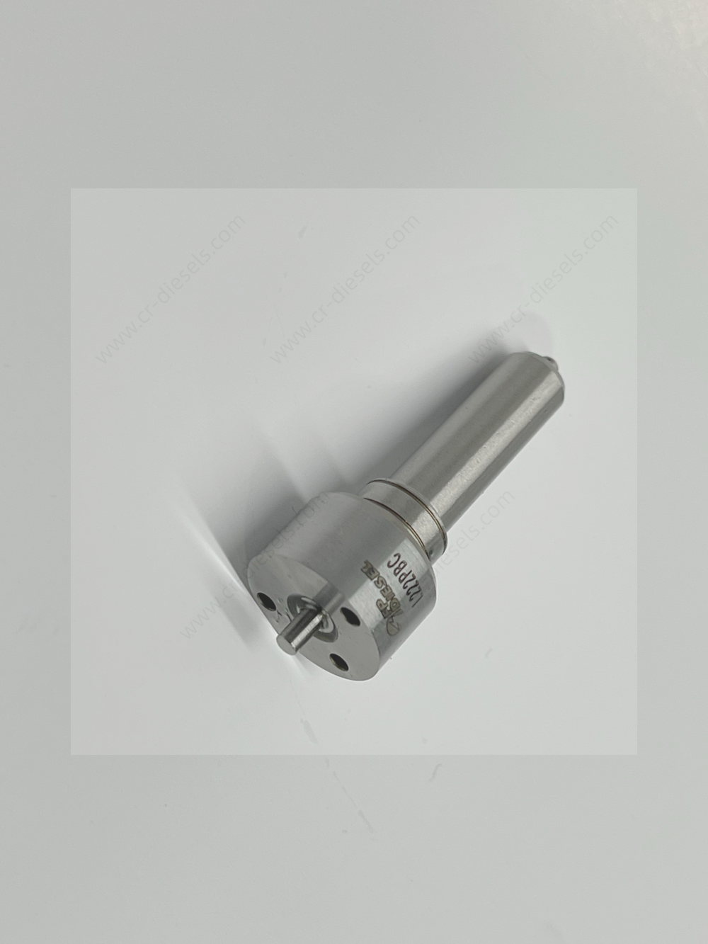 Top-angle detailed view of DLW NZ7004 nozzle head, showing the mechanical fitment, alignment pins, and fluid ports.