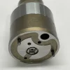 dlw-valve-cv7001-7135-588-bottom-pins Bottom close-up view of DLW CV7001 valve showing high-strength dual alignment pins and precision-honed central plunger bore.