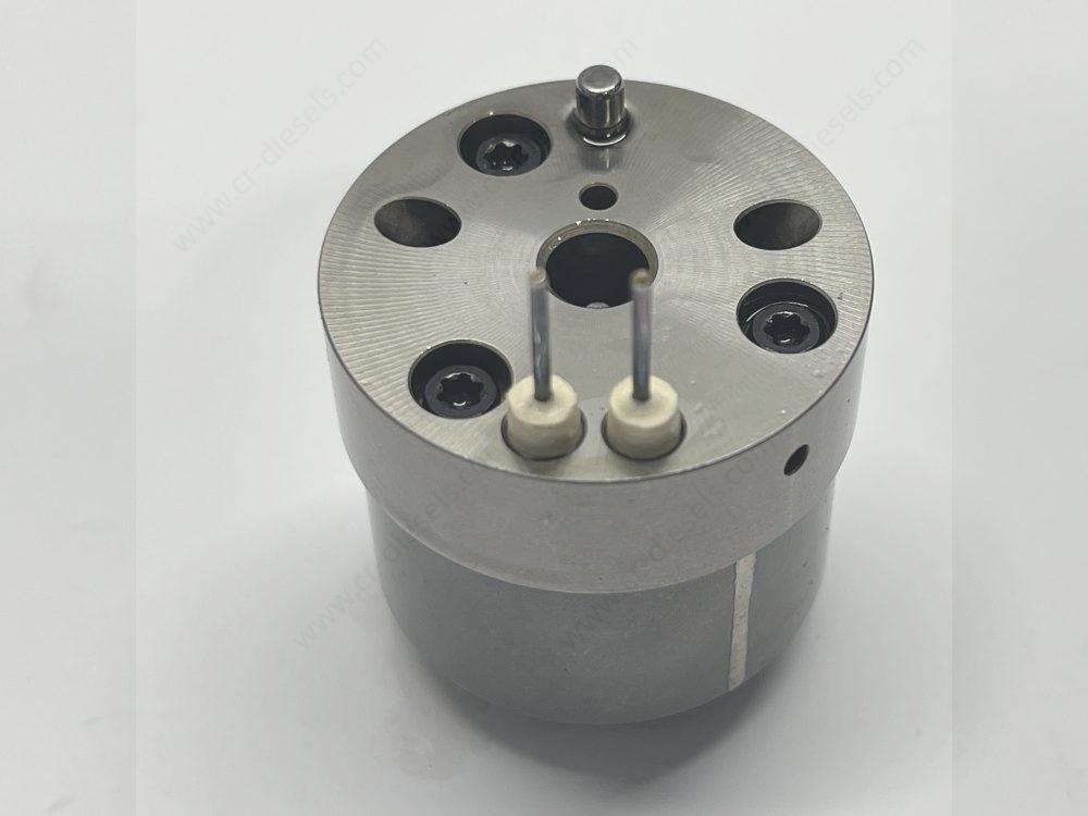 dlw-valve-cv7002-7206-0379-top-angles Close-up of DLW CV7002 valve top surface, featuring dual electrical pins, aligning pin, and bolt channels.