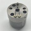 dlw-valve-cv7002-7206-0379-top-angles Close-up of DLW CV7002 valve top surface, featuring dual electrical pins, aligning pin, and bolt channels.